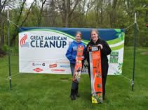 Standing in front of the Great American Cleanup sign