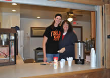 People standing next to coffee